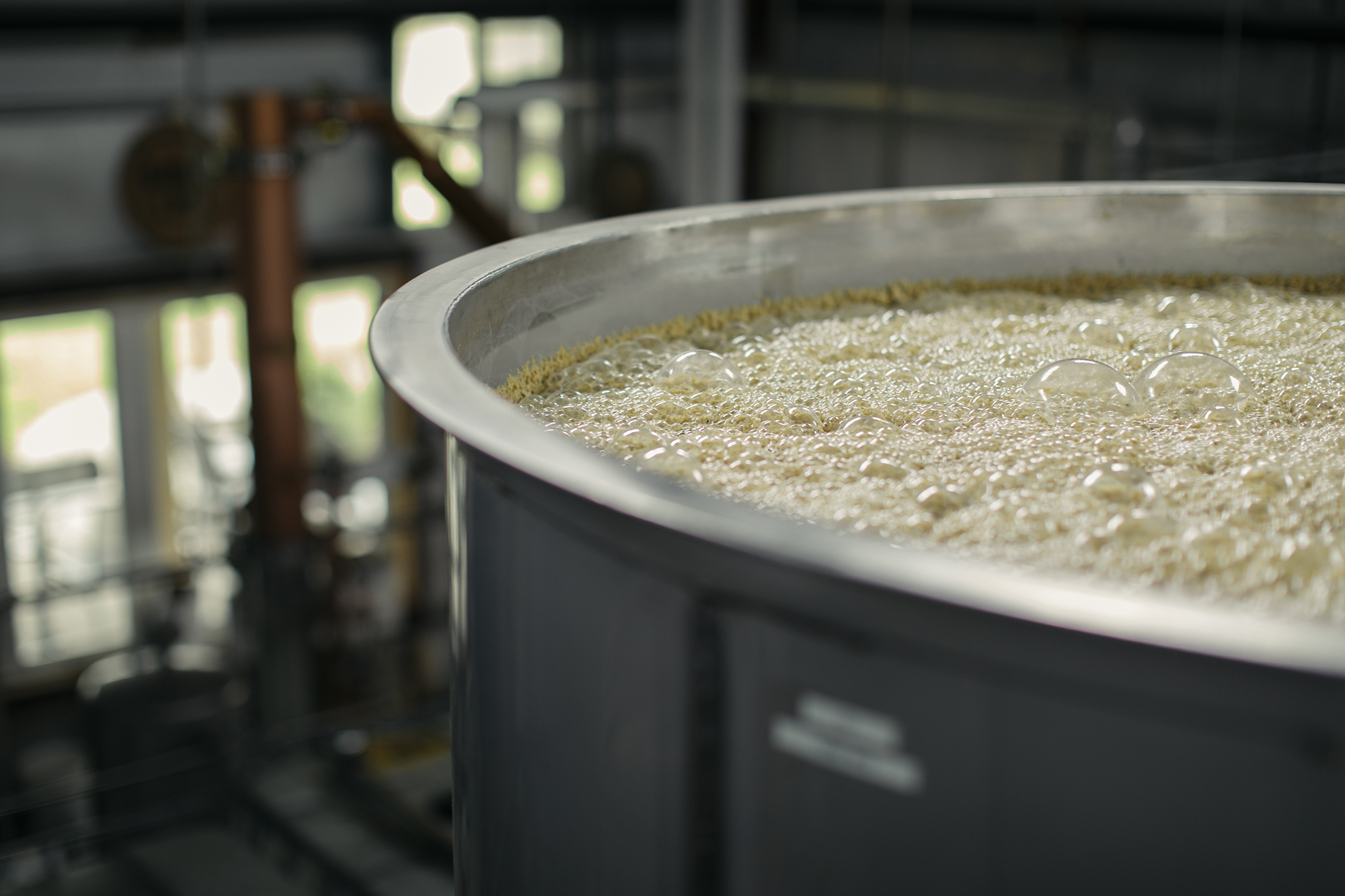 Distilling barrel filled with mash for whiskey